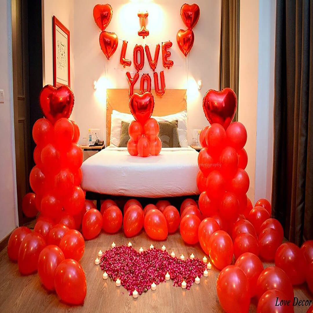 Romantic Decor of Red Balloons and Candle